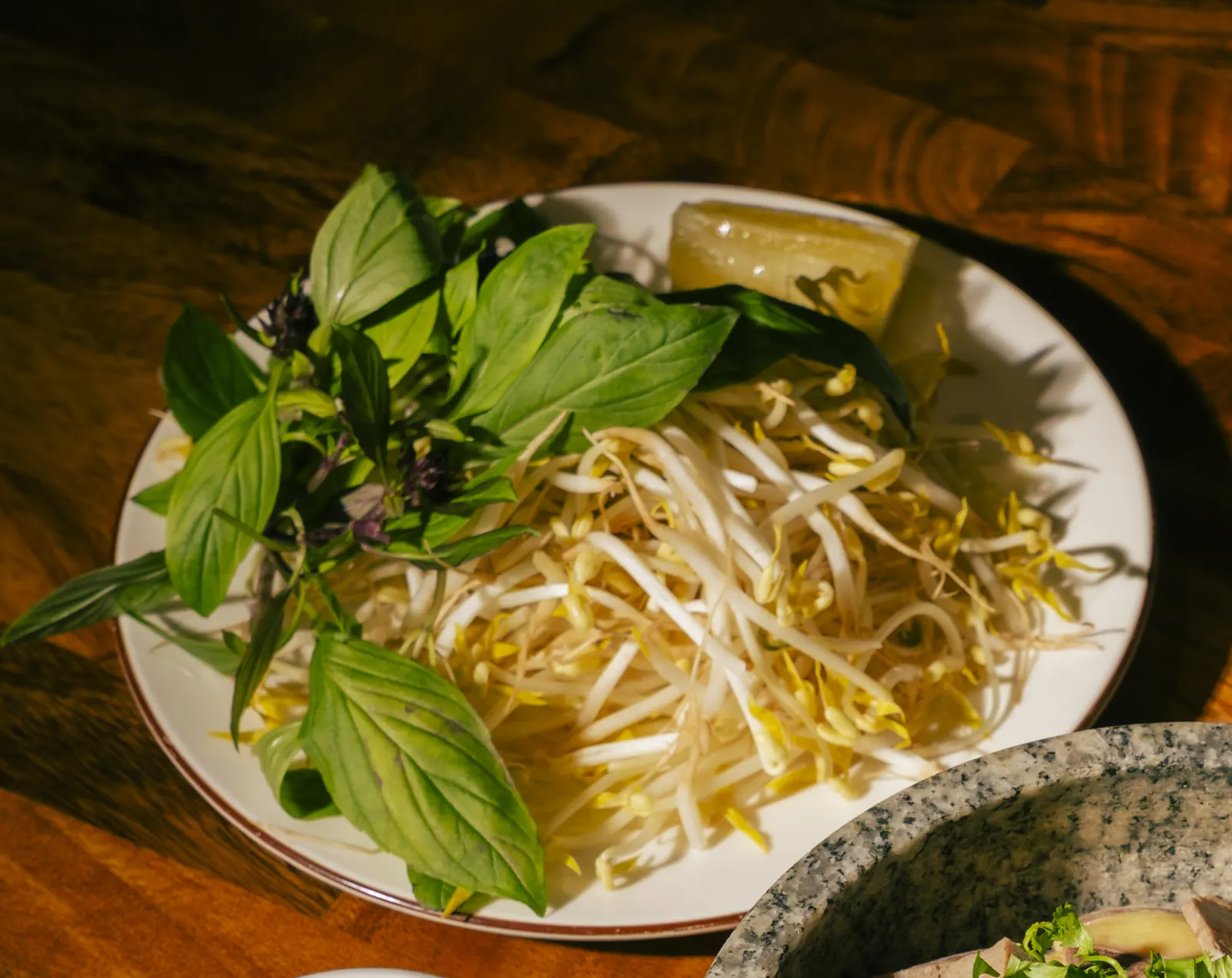 Fresh basil, bean sprouts and greens at Bà Năm Restaurant, Adelaide — the fresh side of the vegetarian Vietnamese menu