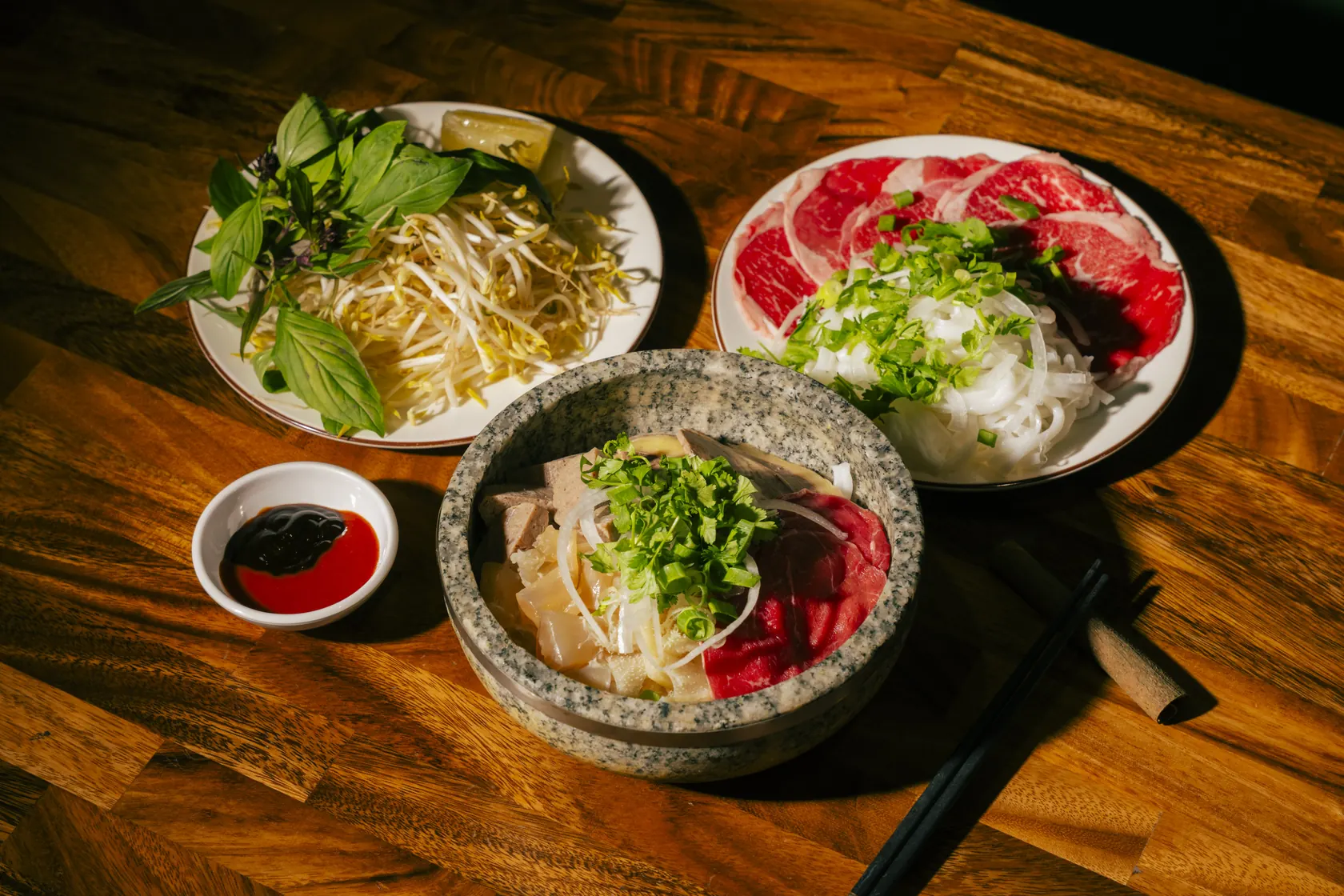 Bà Năm Phở Tái set — paper-thin rare beef, rice noodles, herbs and stone bowl, Adelaide