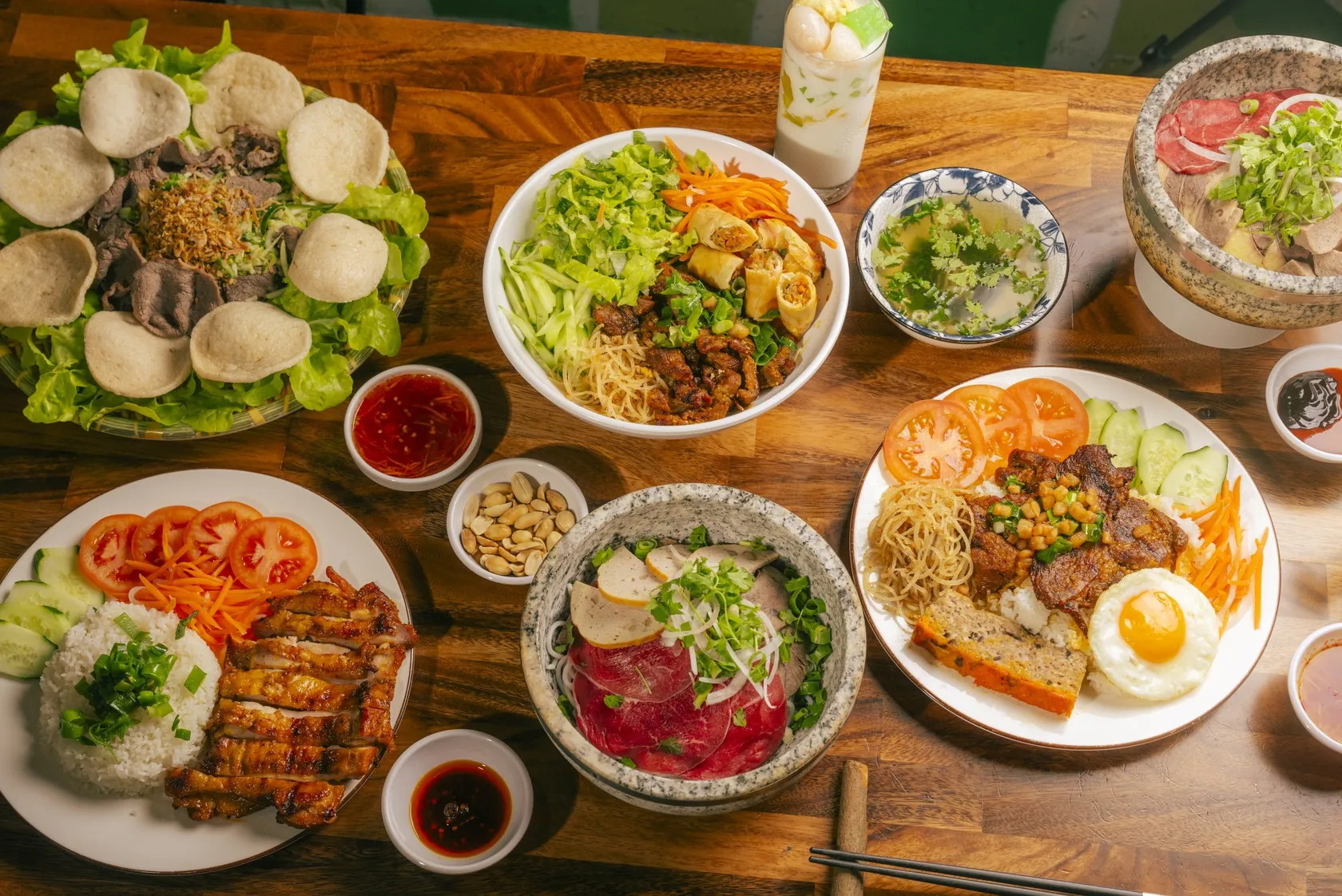 Share table at Bà Năm — stone-bowl phở, cơm tấm and gỏi near Angas Street walk