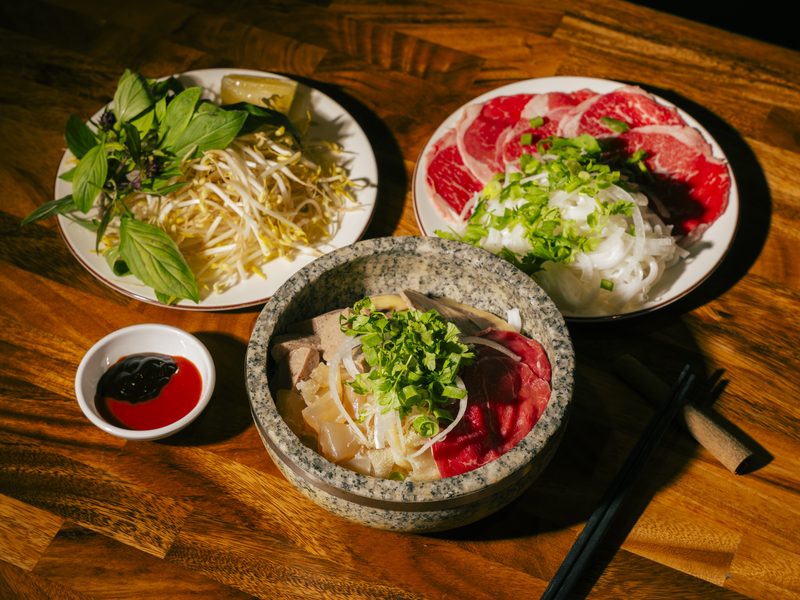 Phở Thố Đá — signature stone bowl beef pho with rare beef and fresh herbs